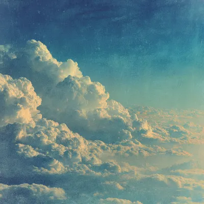 Radiant dawn abstract skyscape in soft halftone and heavy dithered texture, layered clouds glowing with cream light over