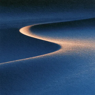 An abstract icon of an existing current being redirected without breaking: a broad indigo gradient stream continues forw